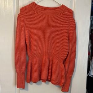 Orange peplum sweater